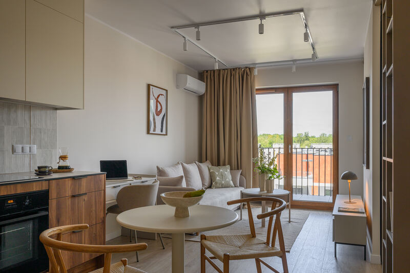 Open-plan kitchen and living area with balcony